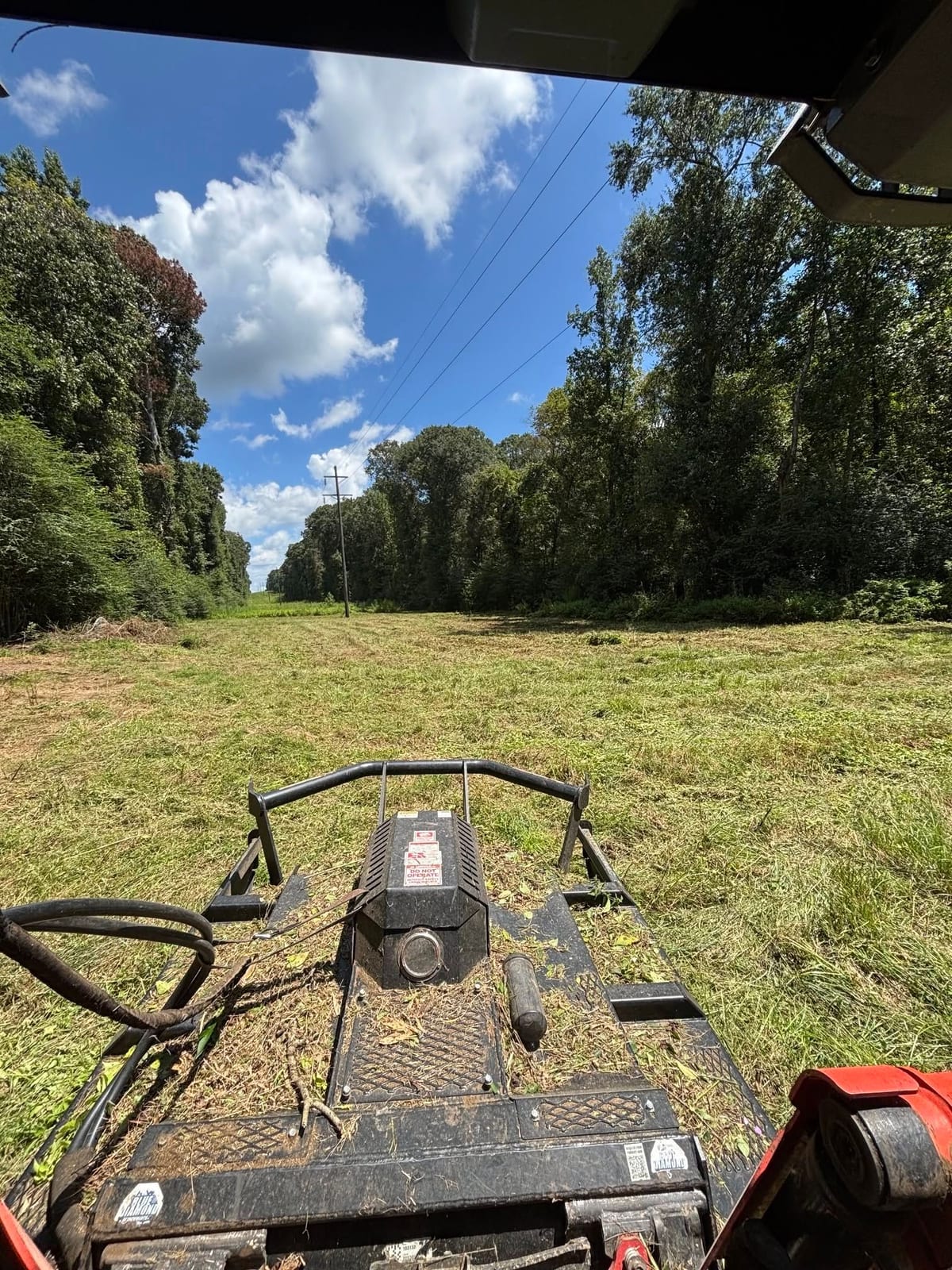Bush hogging a lane through tall grass — Brush Clearing & Bush Hogging in North Mississippi